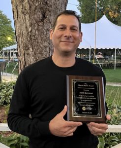 John Kayaian with the Marcia Wynn Award plaque